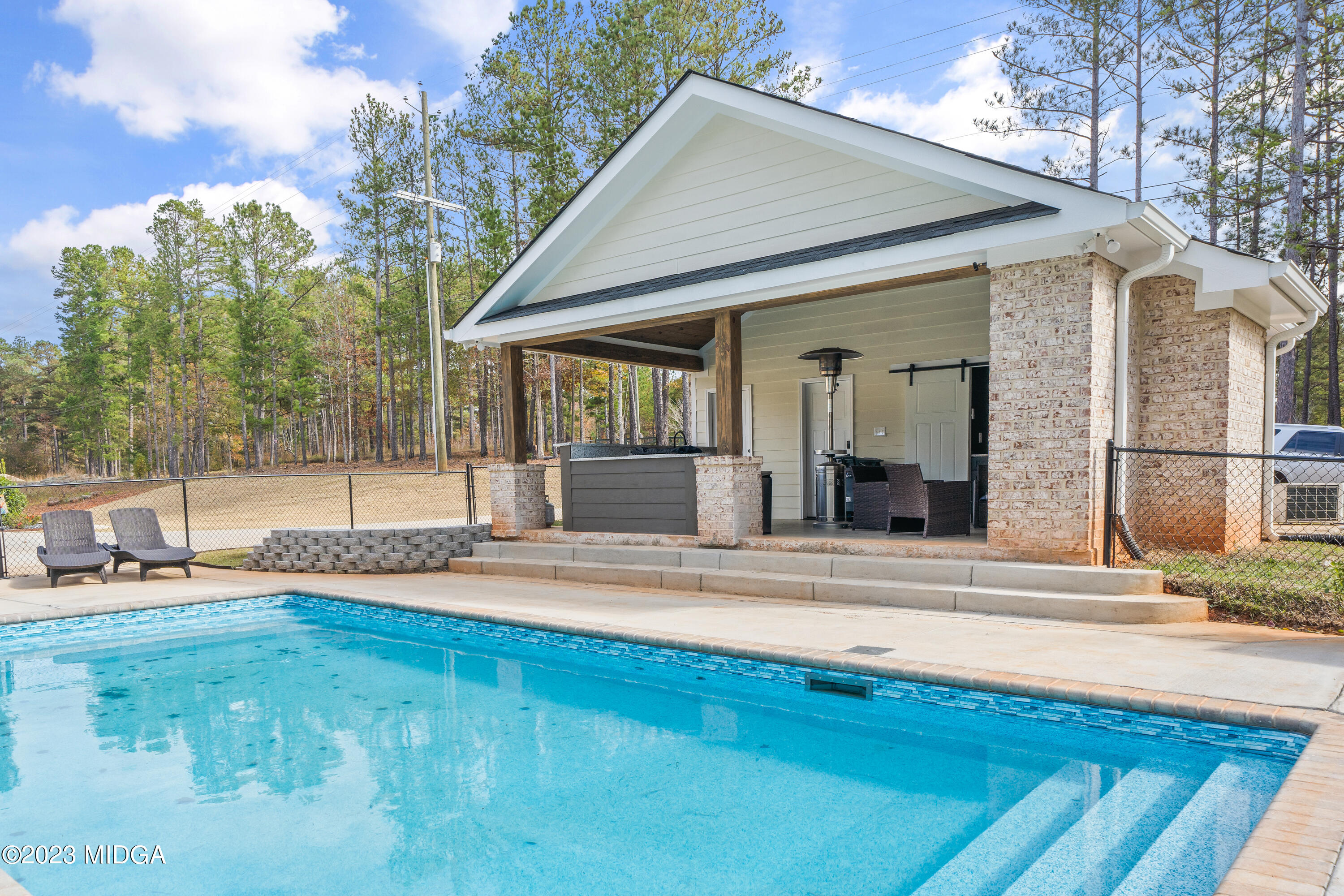 556 Pea Ridge Road Juliette, GA 31046 - Photo 32 of 42 a view of a house with backyard and sitting area