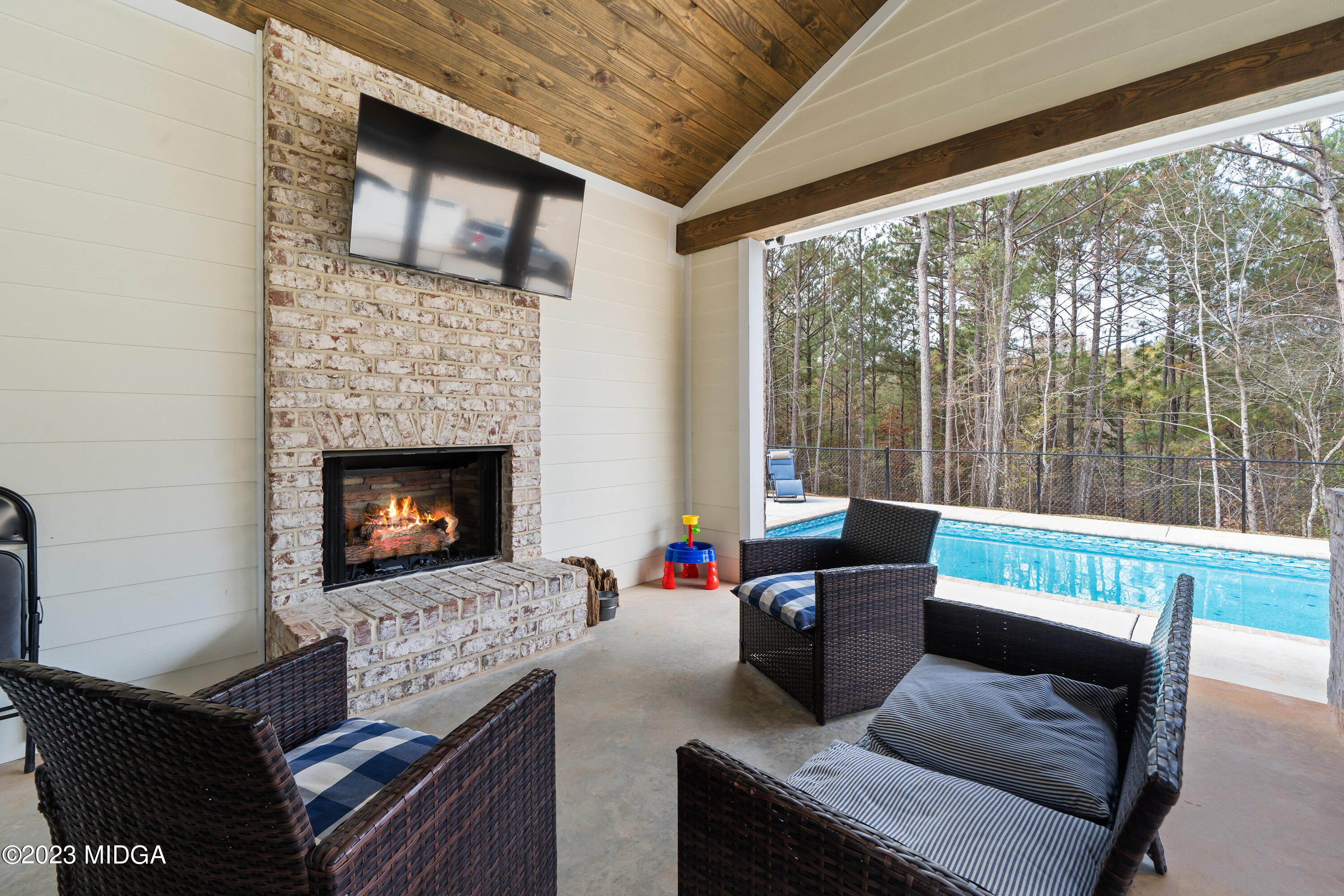 556 Pea Ridge Road Juliette, GA 31046 - Photo 33 of 42 a living room with furniture and a fireplace