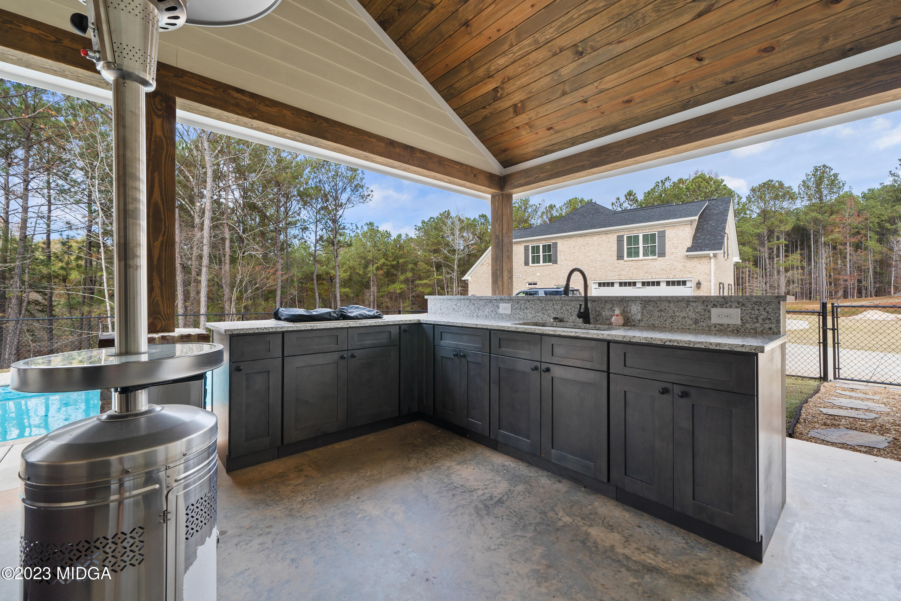 556 Pea Ridge Road Juliette, GA 31046 - Photo 35 of 42 a kitchen with a sink and large windows
