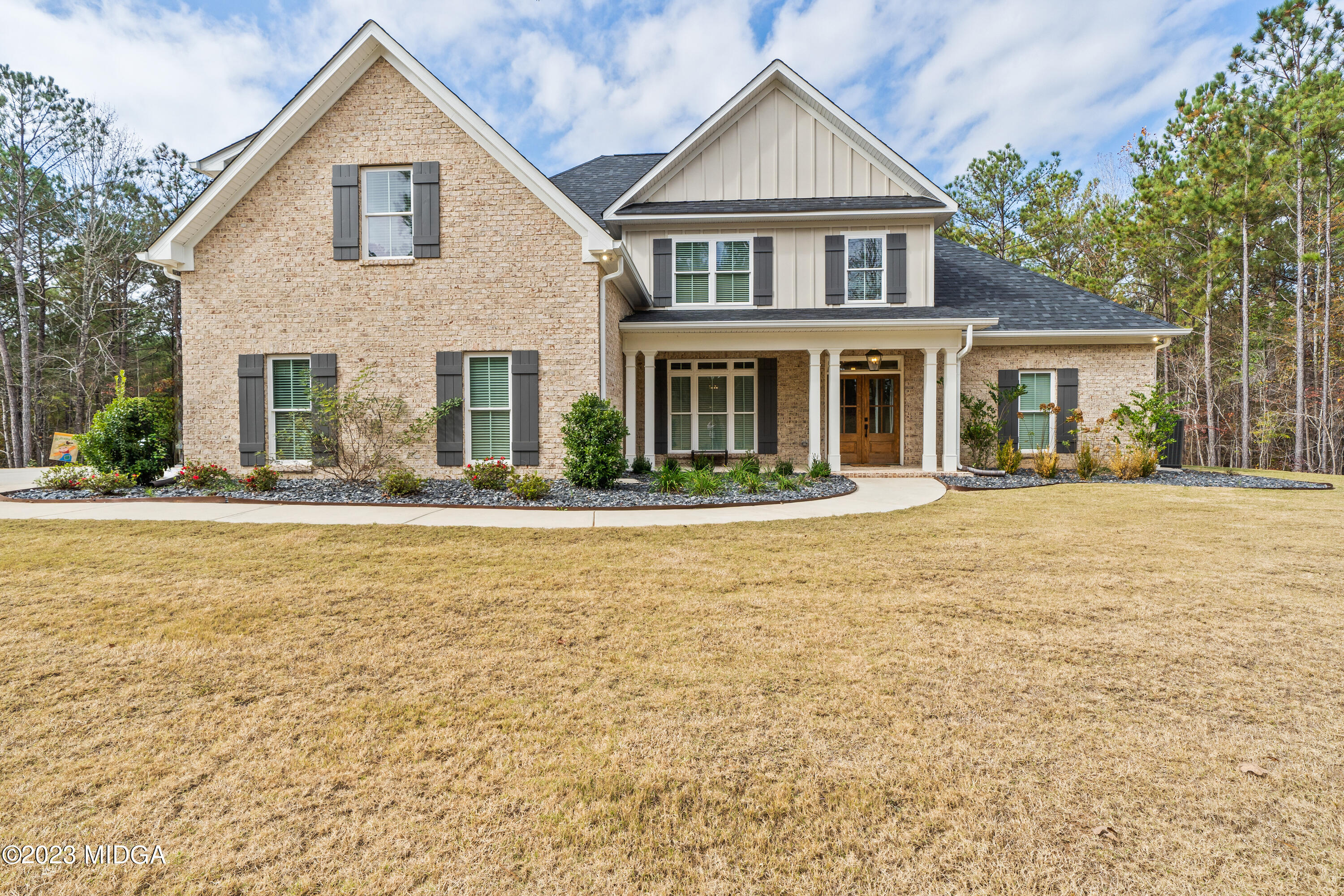 556 Pea Ridge Road Juliette, GA 31046 - Photo 39 of 42 a front view of a house with a yard