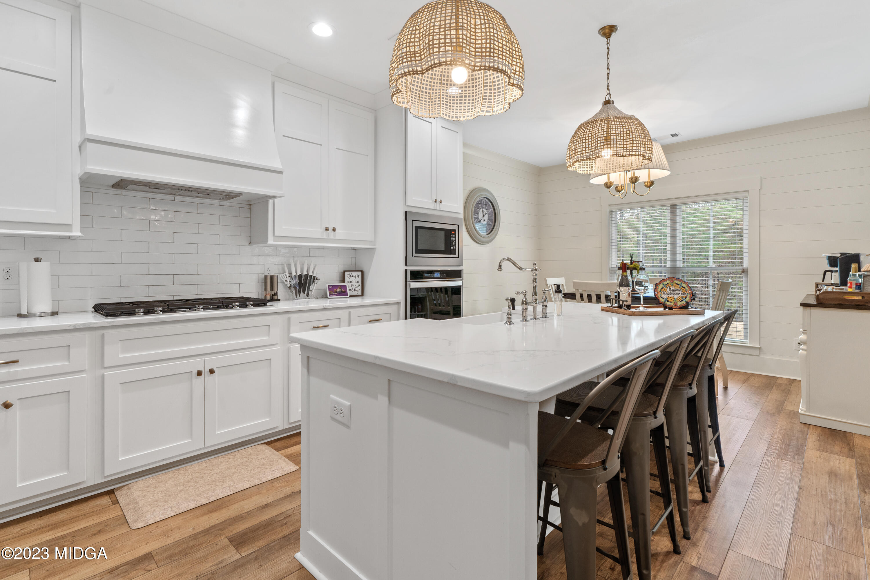 556 Pea Ridge Road Juliette, GA 31046 - Photo 7 of 42 a kitchen with a counter space cabinets and stainless steel appliances