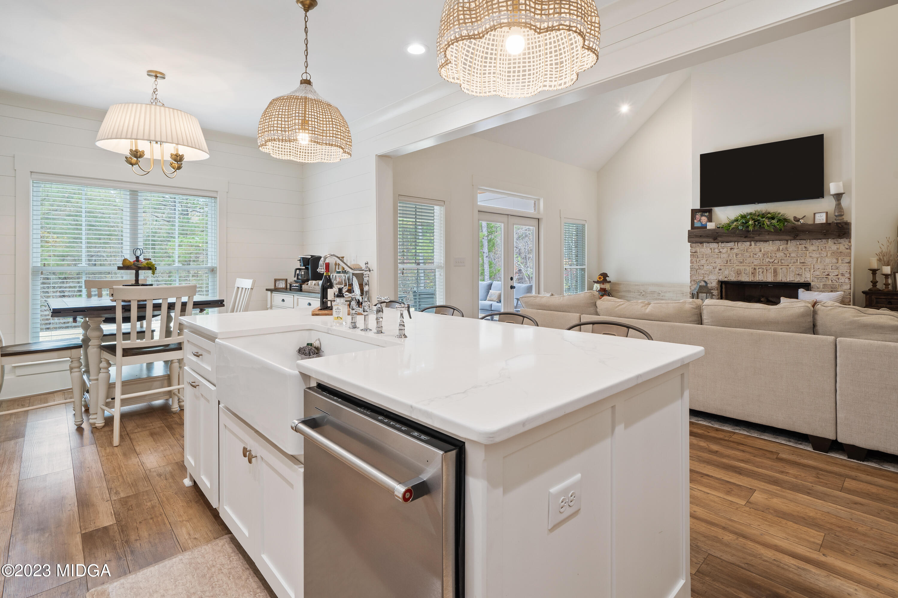 556 Pea Ridge Road Juliette, GA 31046 - Photo 8 of 42 a large white kitchen with a large island oven a sink and a large window