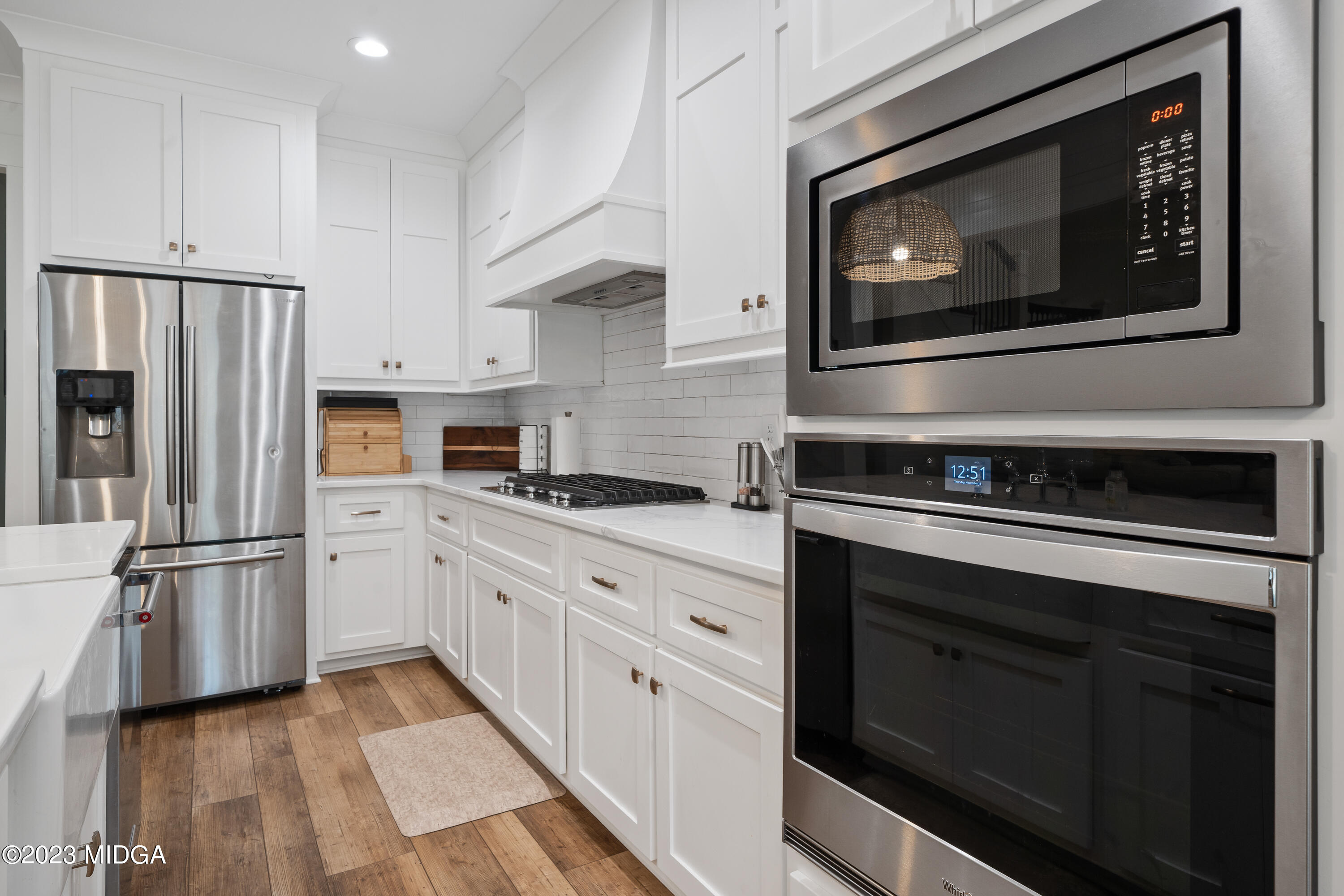 556 Pea Ridge Road Juliette, GA 31046 - Photo 9 of 42 a kitchen with cabinets stainless steel appliances and a counter space