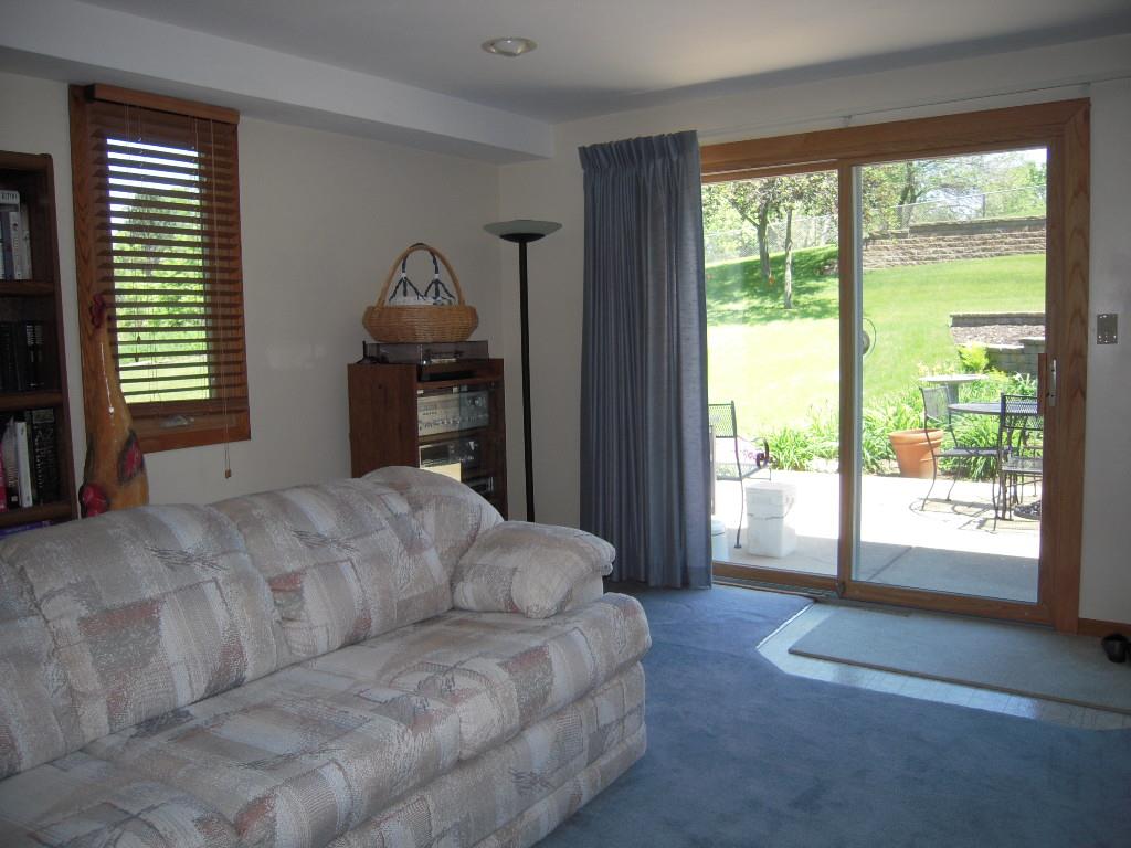 10409 Atwood Road Roscoe, IL 61073 - Photo 13 of 19 a bed sitting in a spacious bedroom next to a window