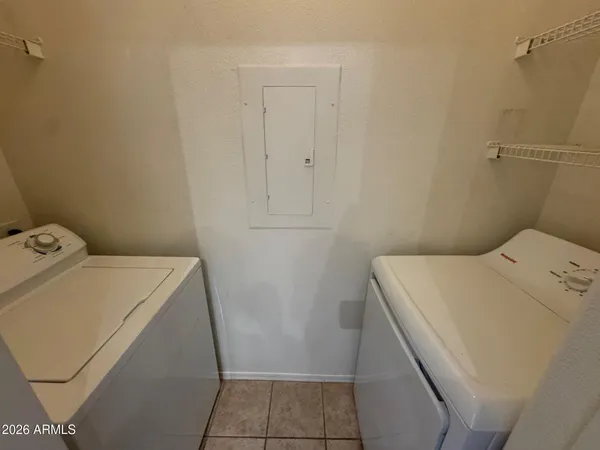 a utility room with dryer and washer