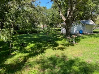 a view of outdoor space with deck and trees