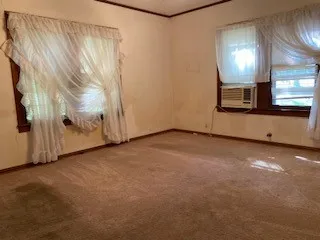 a kitchen with a refrigerator and a window