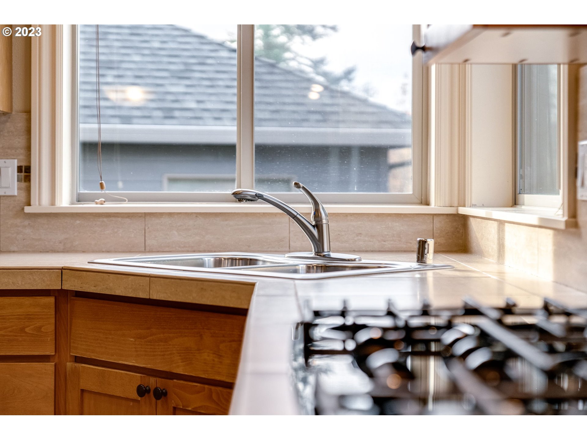 841 Northwest Sacajawea Place Camas, WA 98607 - Photo 11 of 48 a kitchen view with a sink a window and chairs