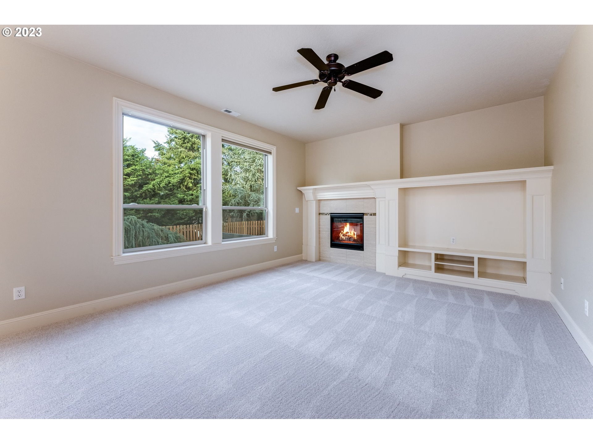 841 Northwest Sacajawea Place Camas, WA 98607 - Photo 16 of 48 a view of empty room with a fireplace and window