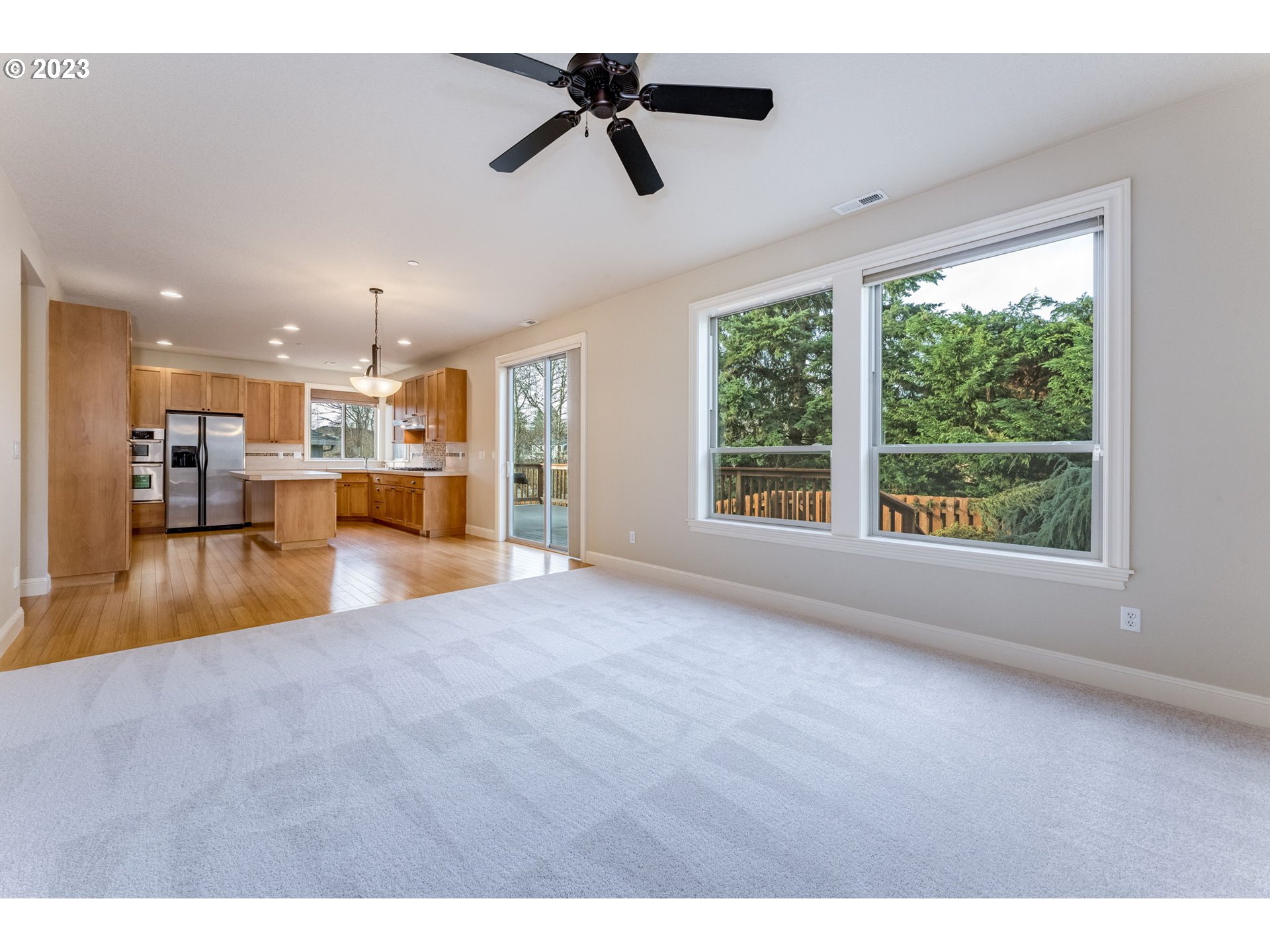 841 Northwest Sacajawea Place Camas, WA 98607 - Photo 18 of 48 a view of an empty room with kitchen view and a window