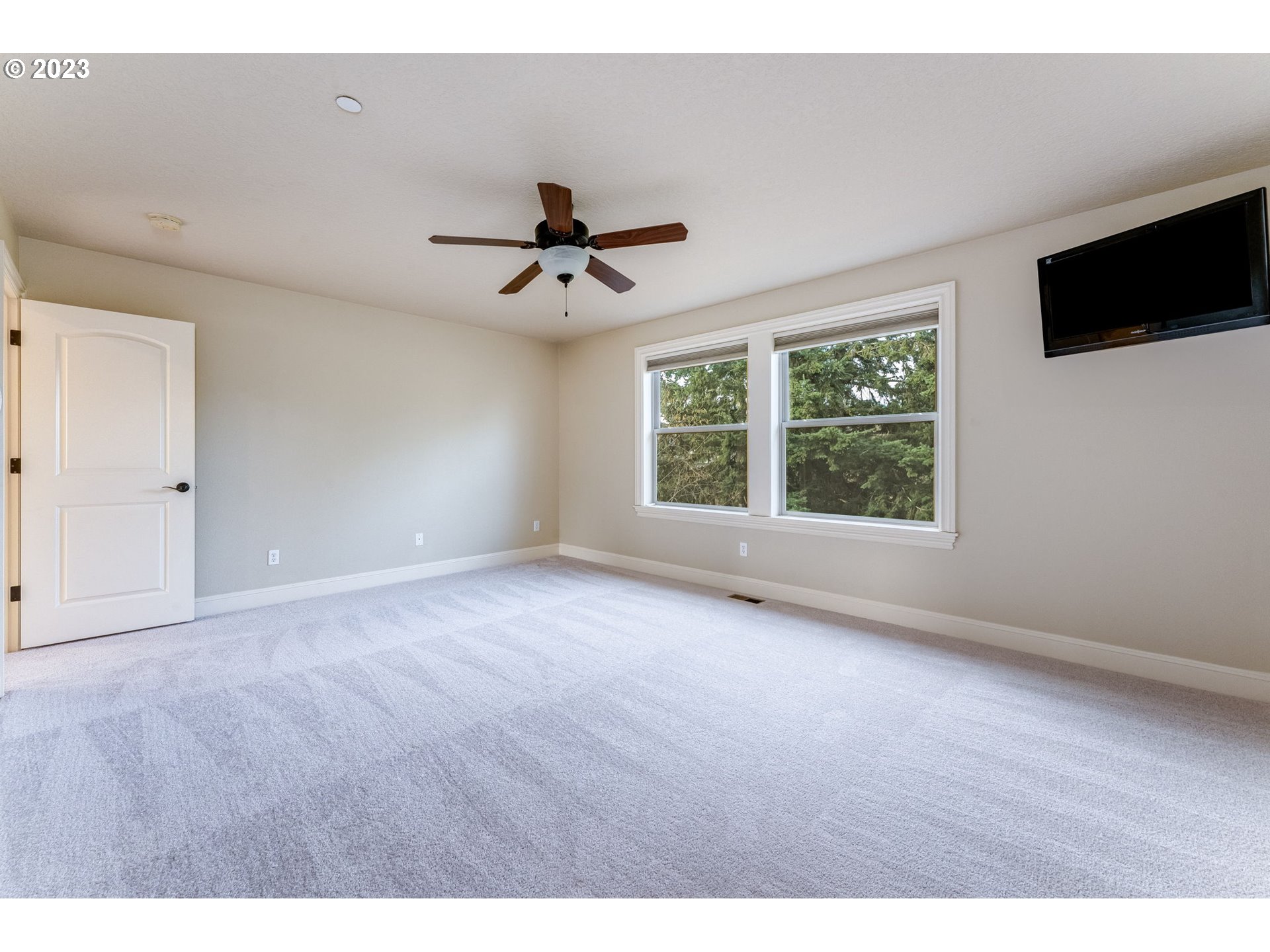 841 Northwest Sacajawea Place Camas, WA 98607 - Photo 28 of 48 a view of an empty room with a window and a ceiling fan