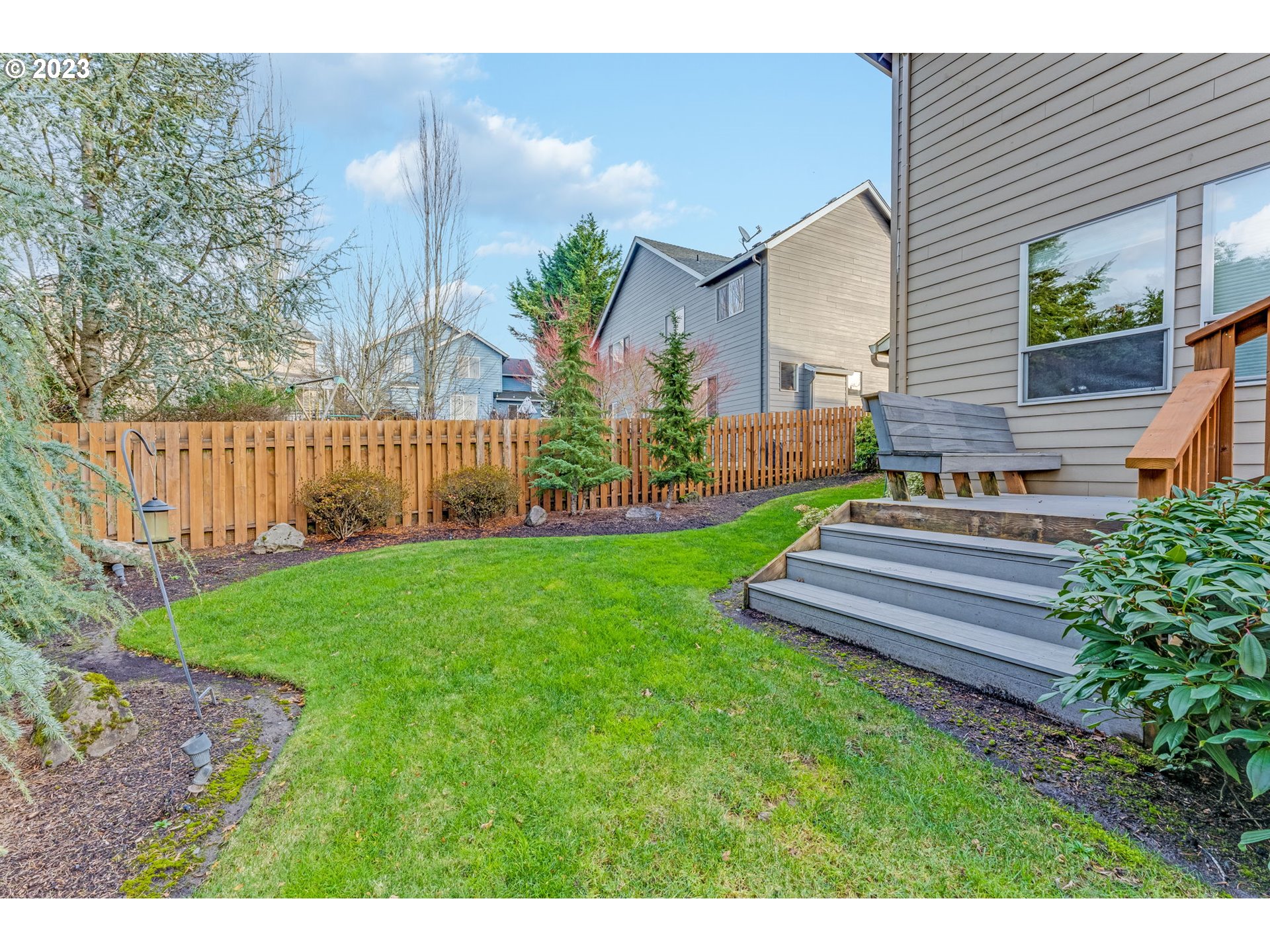 841 Northwest Sacajawea Place Camas, WA 98607 - Photo 42 of 48 a front view of a house with garden and a garden