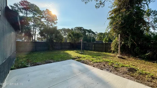 a backyard of a house with lots of green space