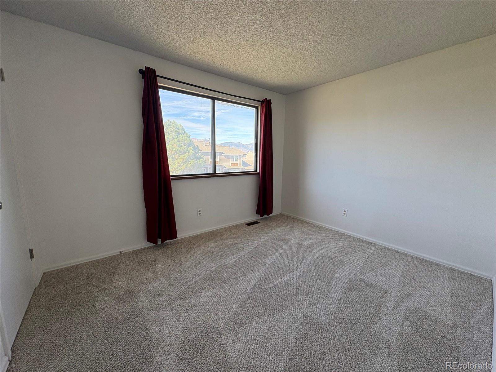 5505 Mansfield Court Colorado Springs, CO 80918 - Photo 12 of 14 an empty room with a window