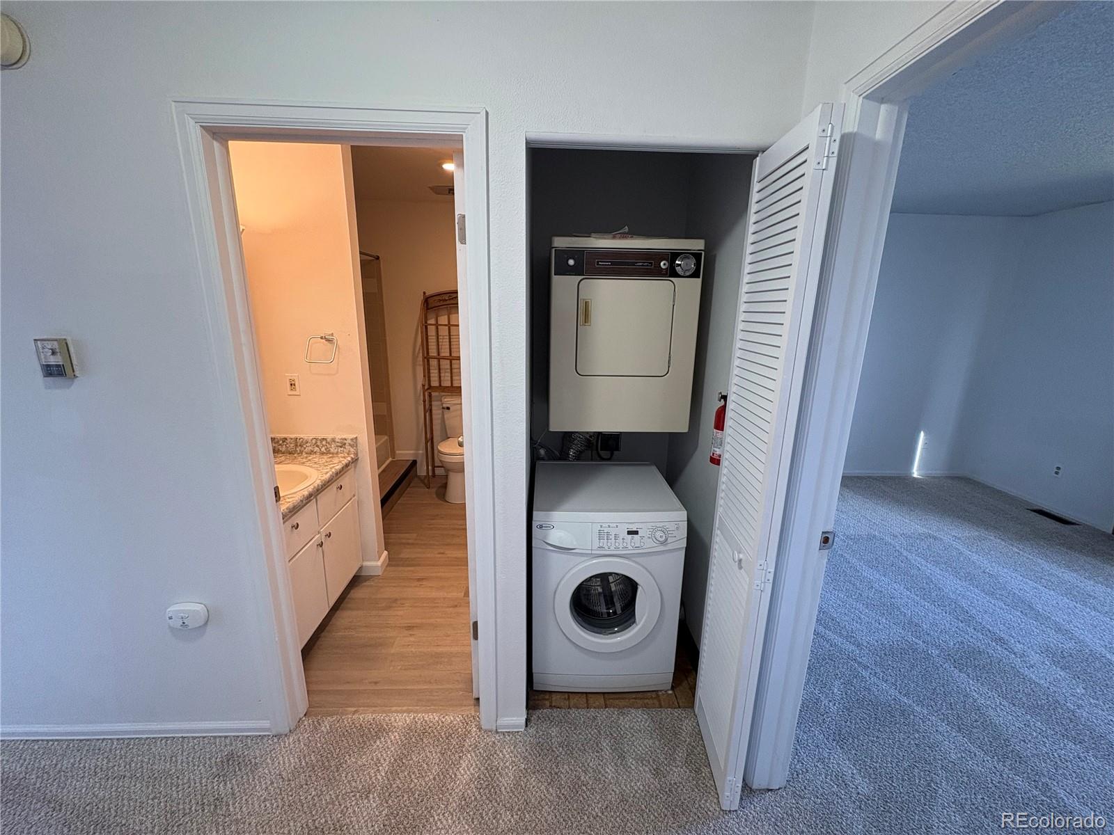 5505 Mansfield Court Colorado Springs, CO 80918 - Photo 10 of 14 a view of a storage and utility room with a washer and dryer