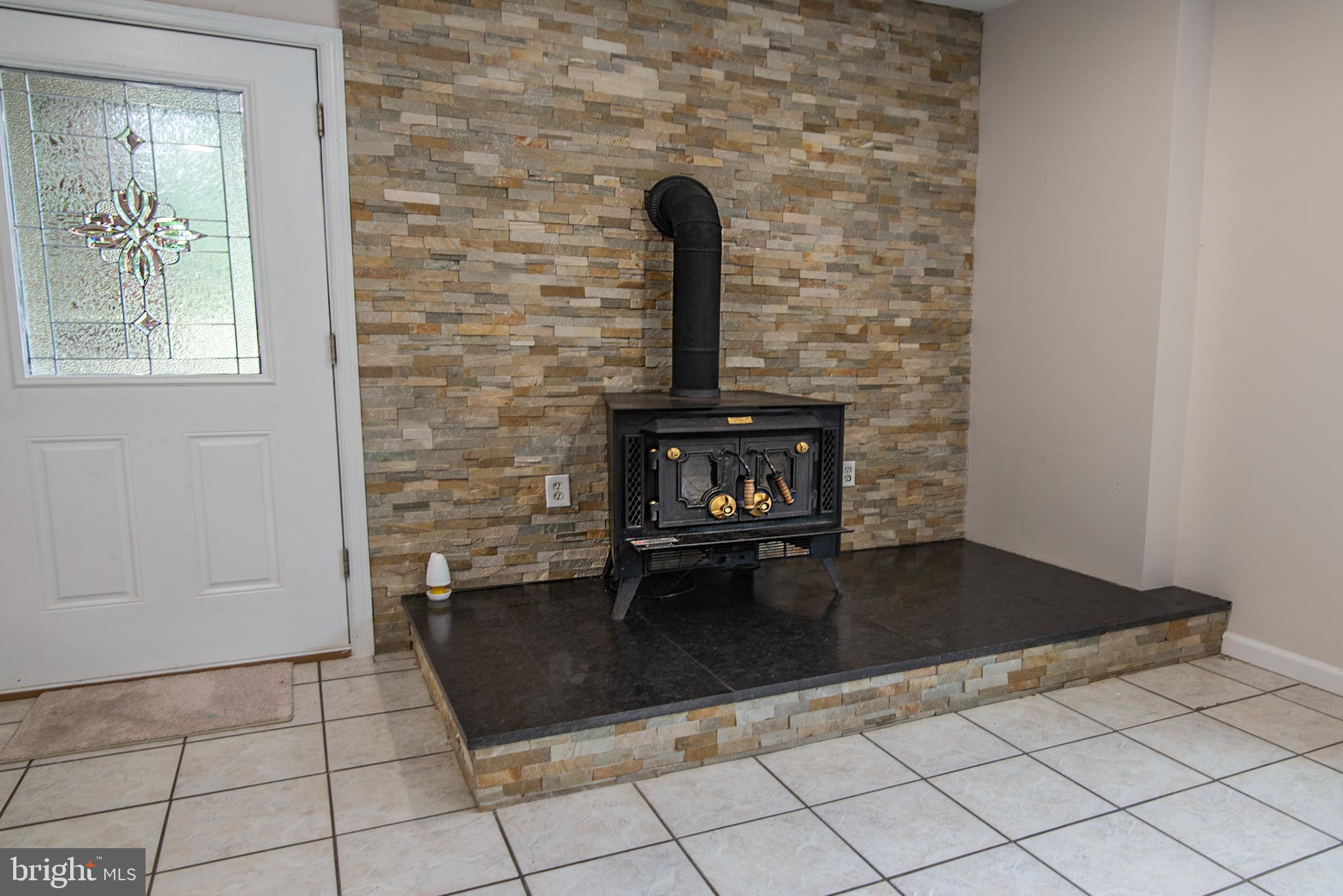 4748 Dickerson Road Partlow, VA 22534 - Photo 8 of 40 Fireplace in dining room/family room