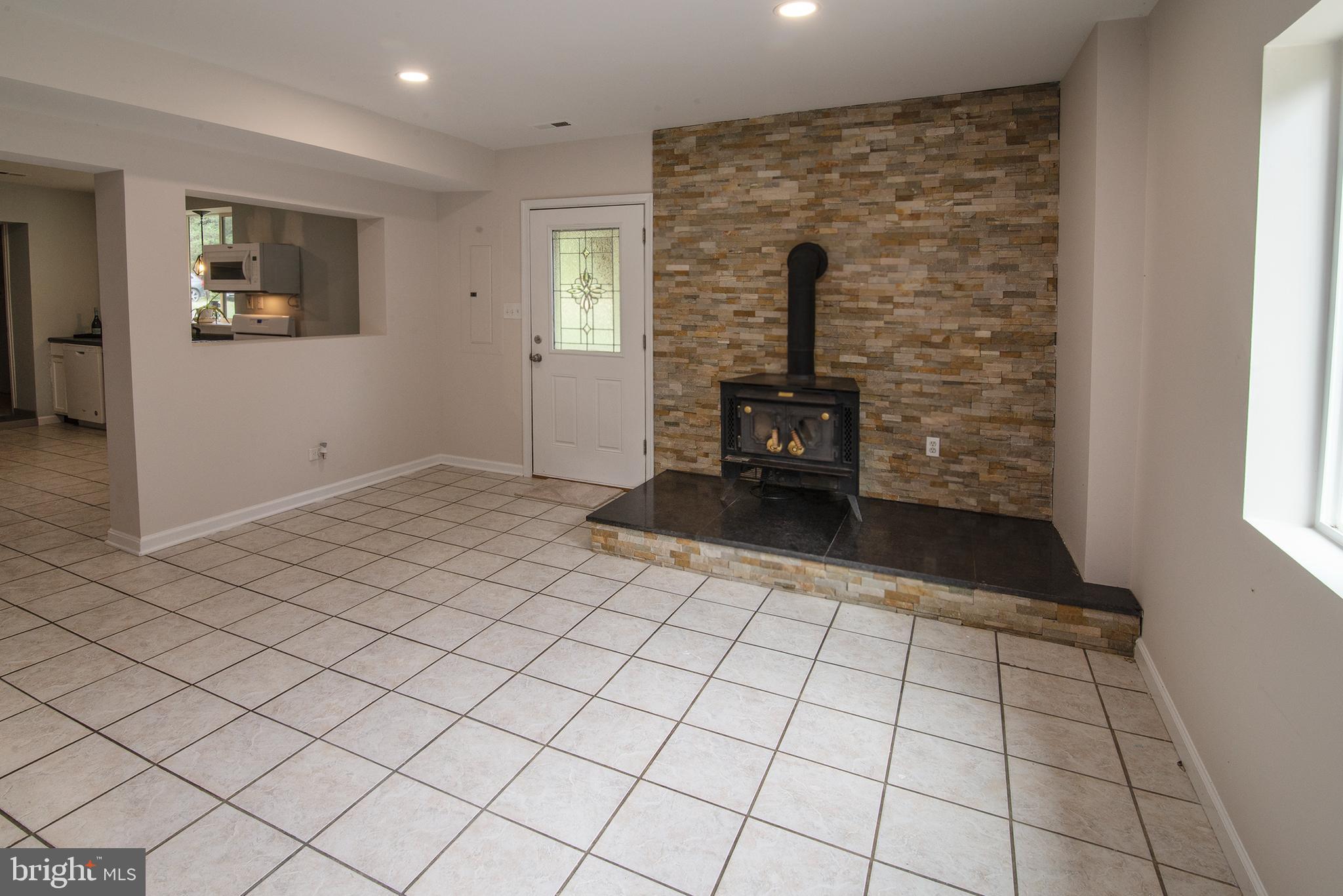4748 Dickerson Road Partlow, VA 22534 - Photo 9 of 40 Fireplace in dining room/family room
