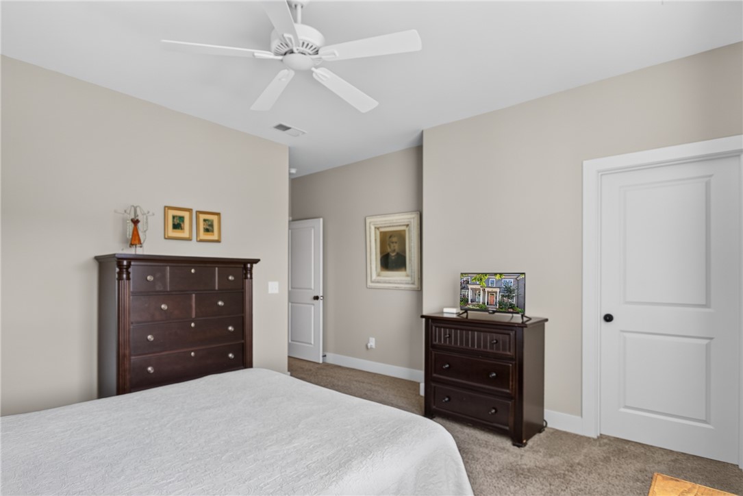 112 Tuttle Street Clemson, SC 29631 - Photo 25 of 46 Well-lit and tranquil, this inviting bedroom space offers comfort and quiet relaxation.