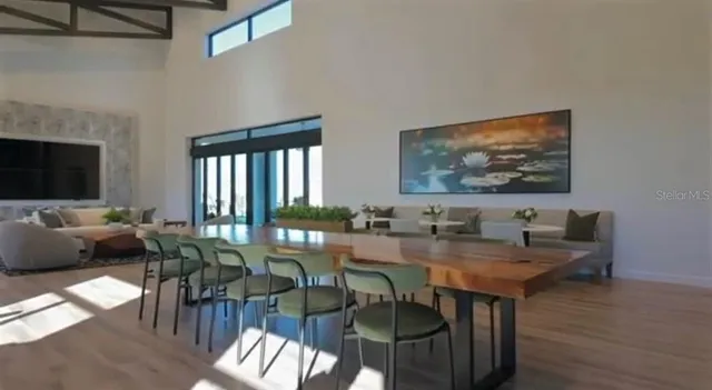 a view of a dining room with furniture window and wooden floor