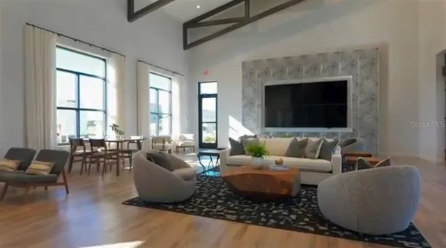 a living room with furniture wooden floor and a fireplace