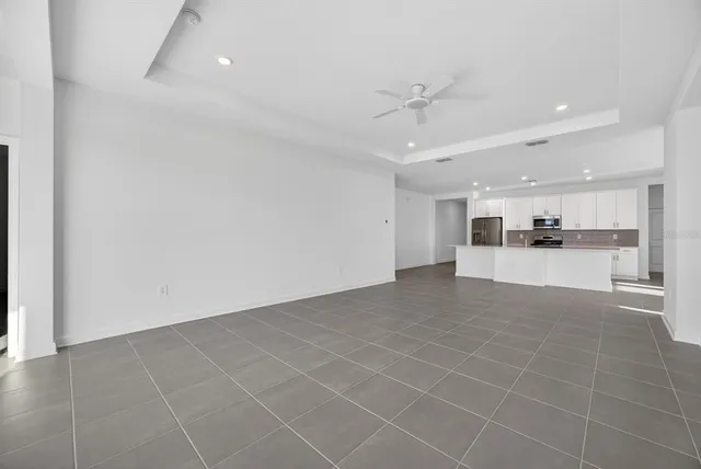 a view of a kitchen with a sink and cabinets
