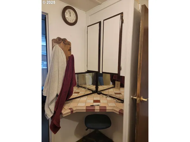 a view of storage and utility room with washer and dryer