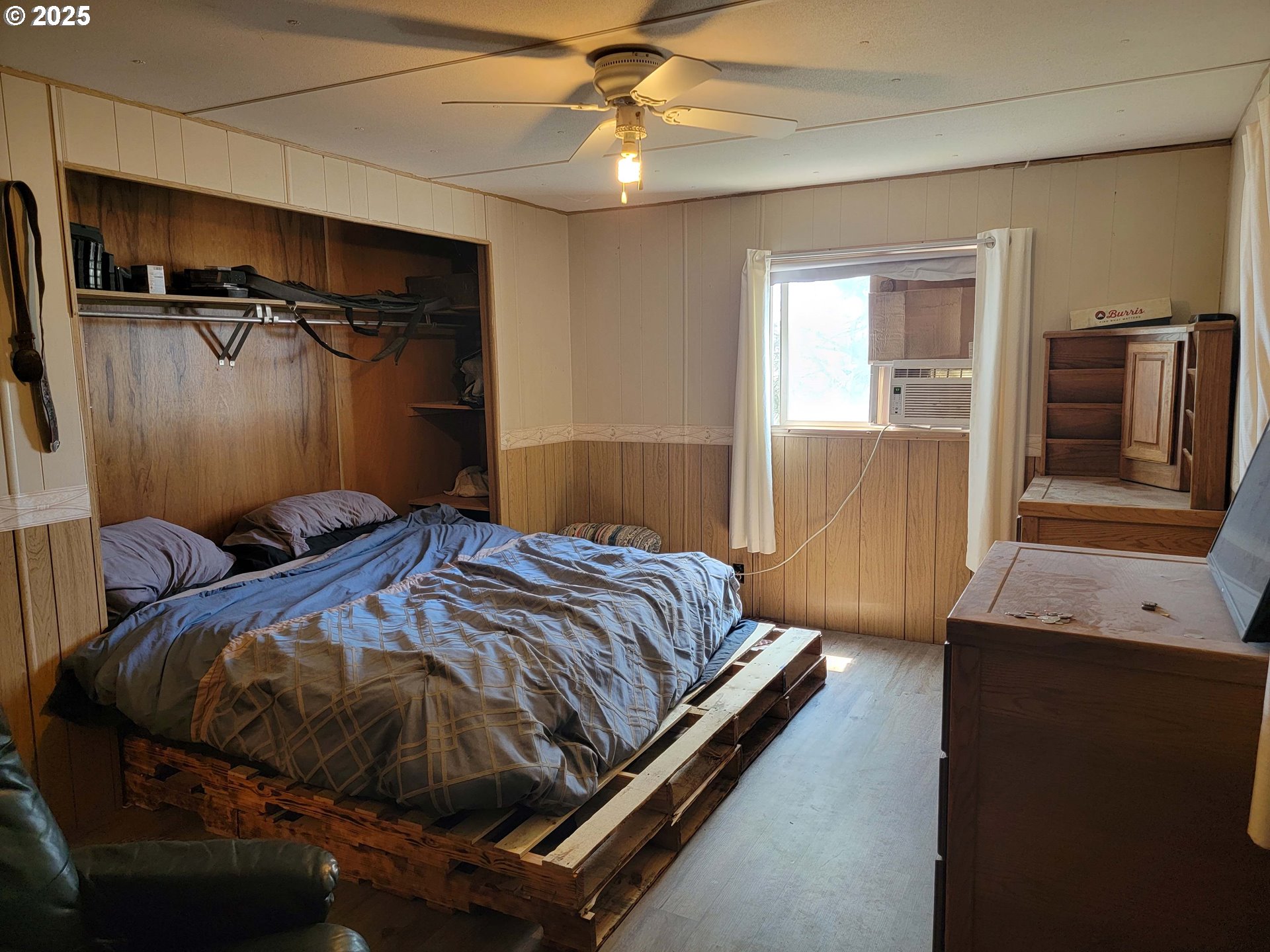 57580 Fall Road Christmas Valley, OR 97641 - Photo 16 of 38 a bedroom with a bed and a flat tv screen