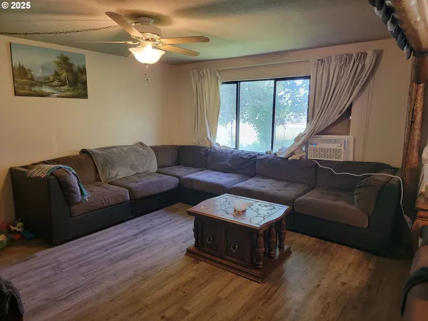 a living room with furniture and a window