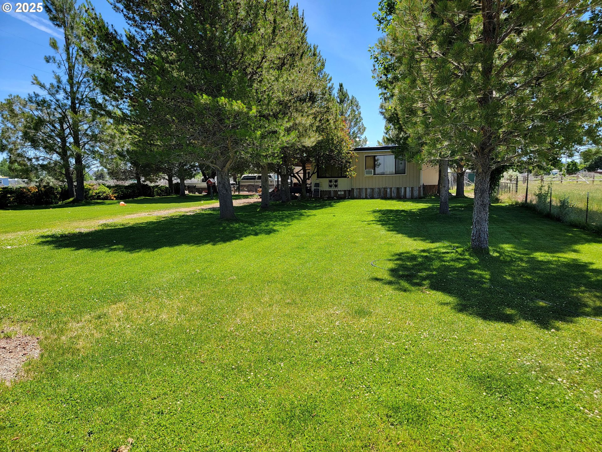 57580 Fall Road Christmas Valley, OR 97641 - Photo 21 of 38 a view of a house with a yard