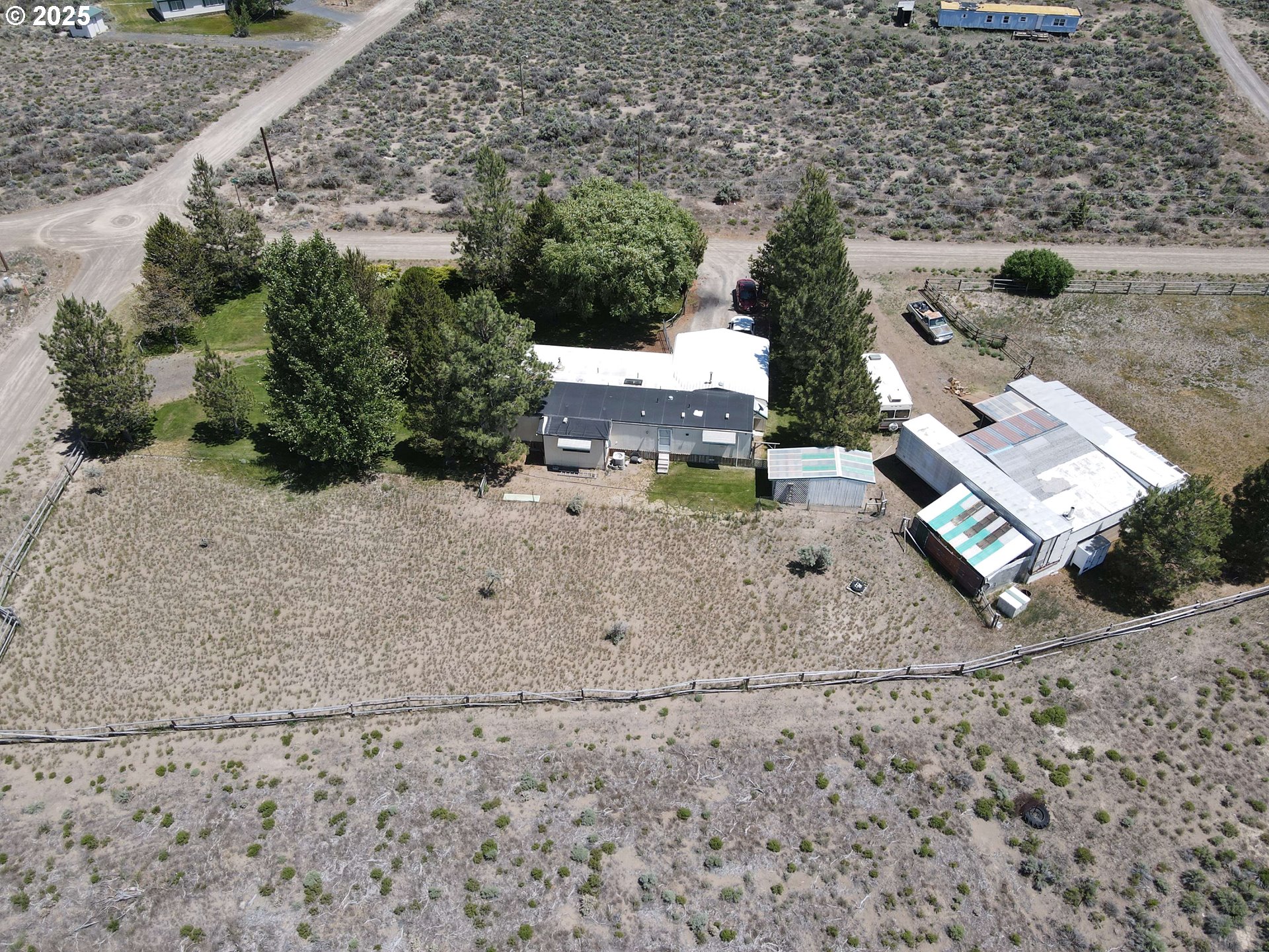 57580 Fall Road Christmas Valley, OR 97641 - Photo 23 of 38 an aerial view of a house with a yard