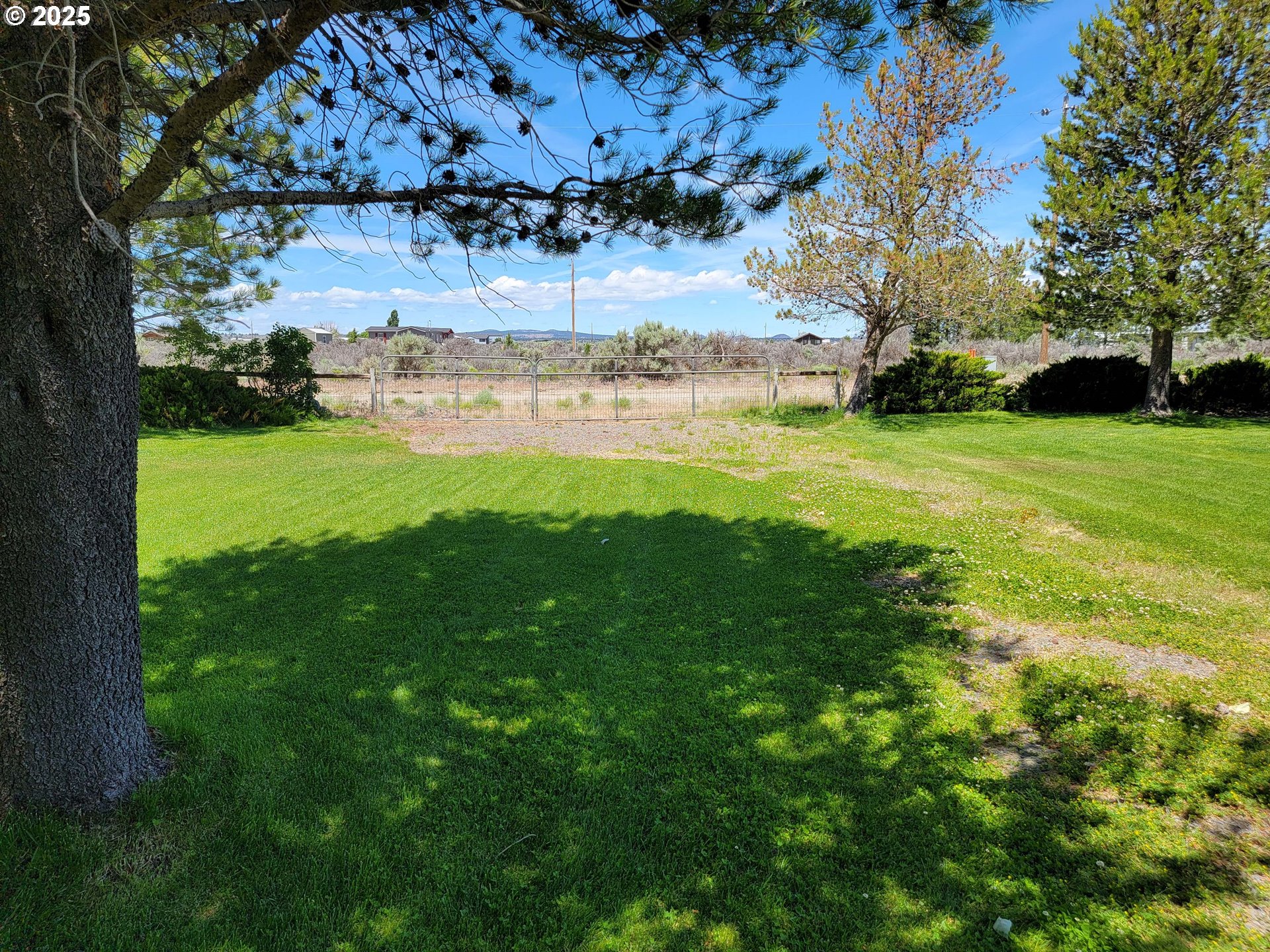 57580 Fall Road Christmas Valley, OR 97641 - Photo 25 of 38 a view of a yard with an house and garden