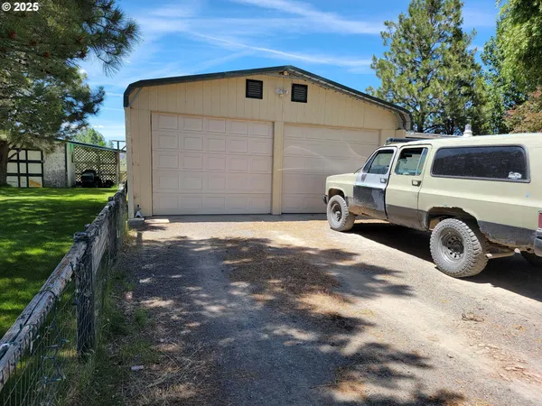 a view of a car in front of a house