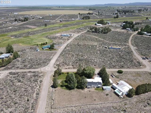 an aerial view of a house with a ocean view