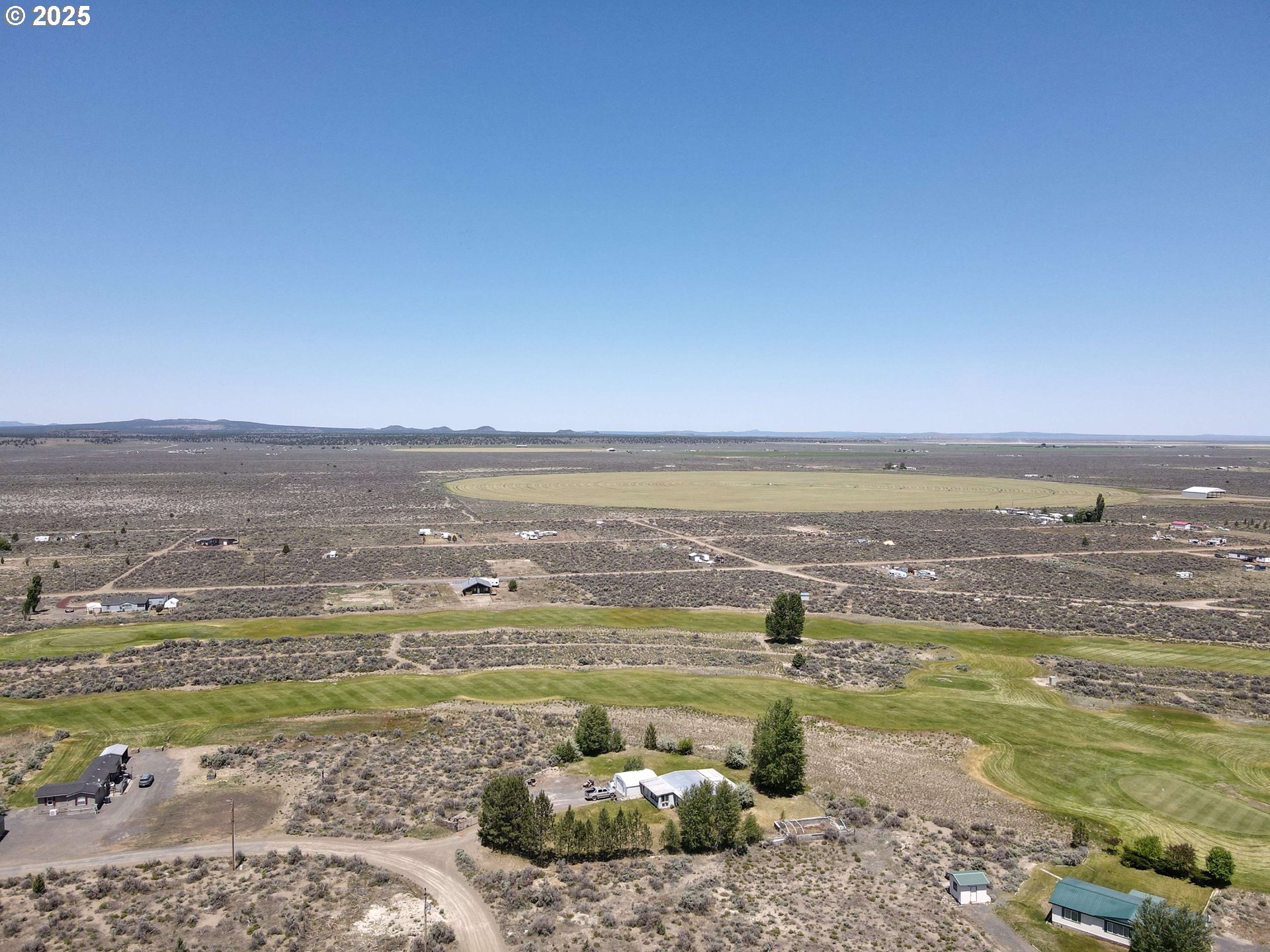 57580 Fall Road Christmas Valley, OR 97641 - Photo 36 of 38 a view of a large body of water with lots of buildings in the background
