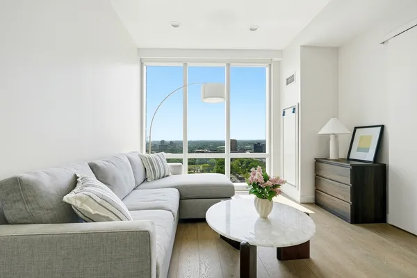 a living room with furniture and a large window