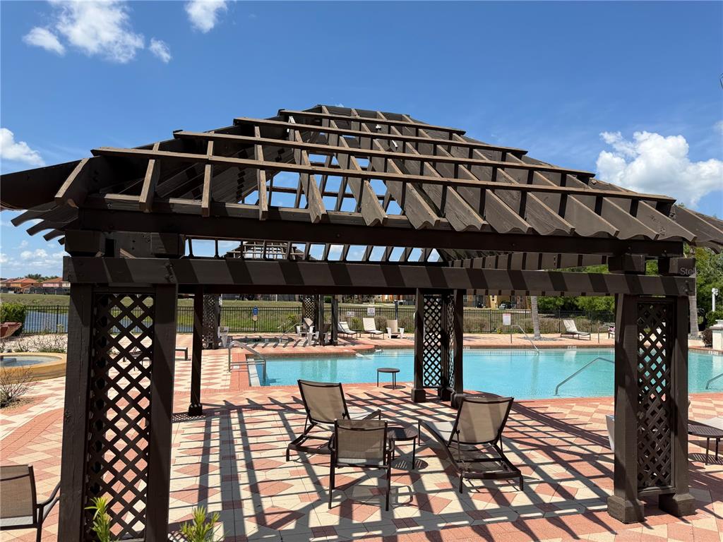 4573 Ada Lane Kissimmee, FL 34746 - Photo 31 of 37 a front view of a building with glass door and outdoor space