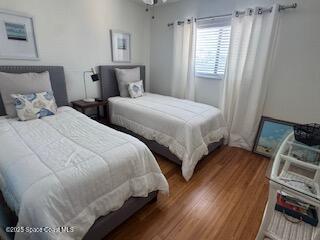 3245 Beach View Way Melbourne Beach, FL 32951 - Photo 11 of 21 a bedroom with two beds and a window