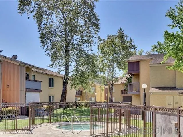 5978 Rancho Mission Road, Unit 264 San Diego, CA 92108 - Photo 16 of 22 a view of a house with a backyard