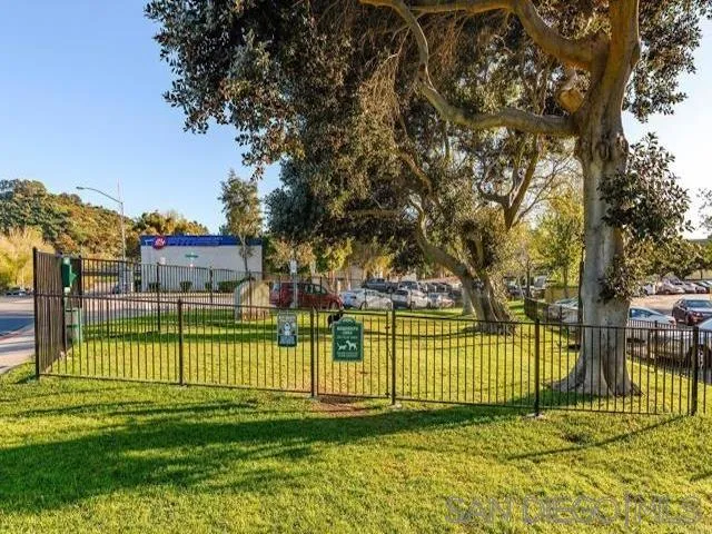 5978 Rancho Mission Road, Unit 264 San Diego, CA 92108 - Photo 19 of 22 a view of a park with a large trees