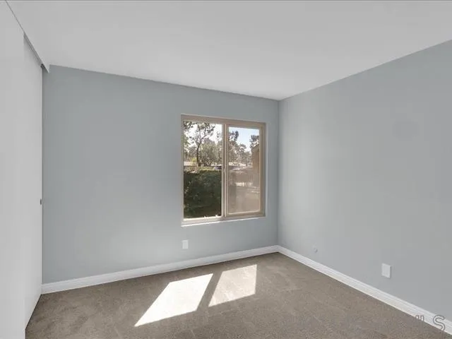 5978 Rancho Mission Road, Unit 264 San Diego, CA 92108 - Photo 7 of 22 an empty room with a window