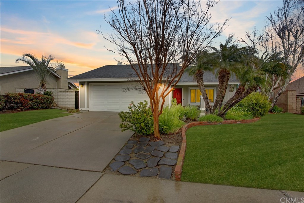 7479 Center Avenue Rancho Cucamonga, CA 91730 - Photo 1 of 1 a front view of a house with garden