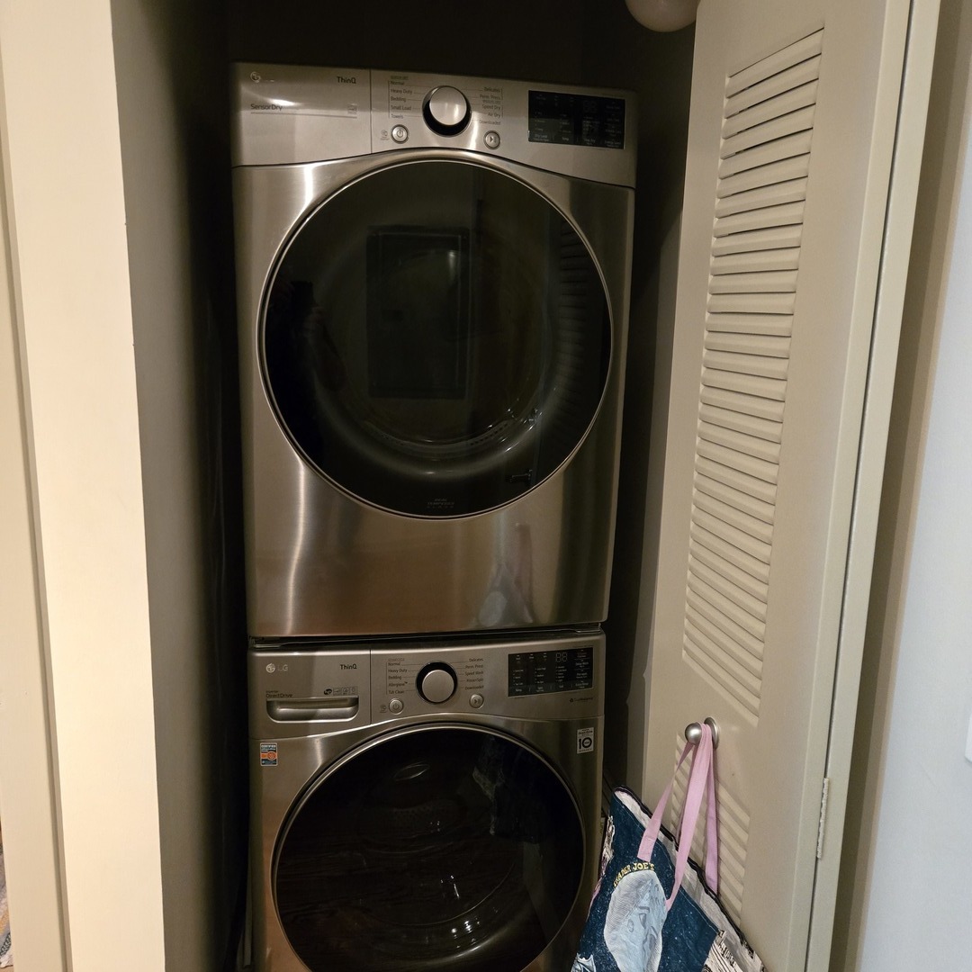 1111 West 15th Street, Unit 228 Chicago, IL 60608 - Photo 25 of 32 a utility room with dryer and washer