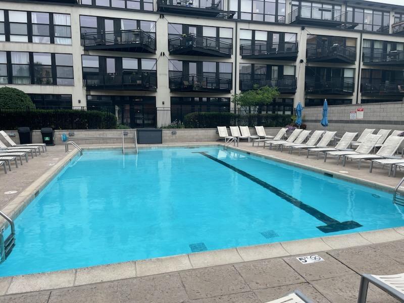 1111 West 15th Street, Unit 228 Chicago, IL 60608 - Photo 29 of 32 a front view of a house with swimming pool