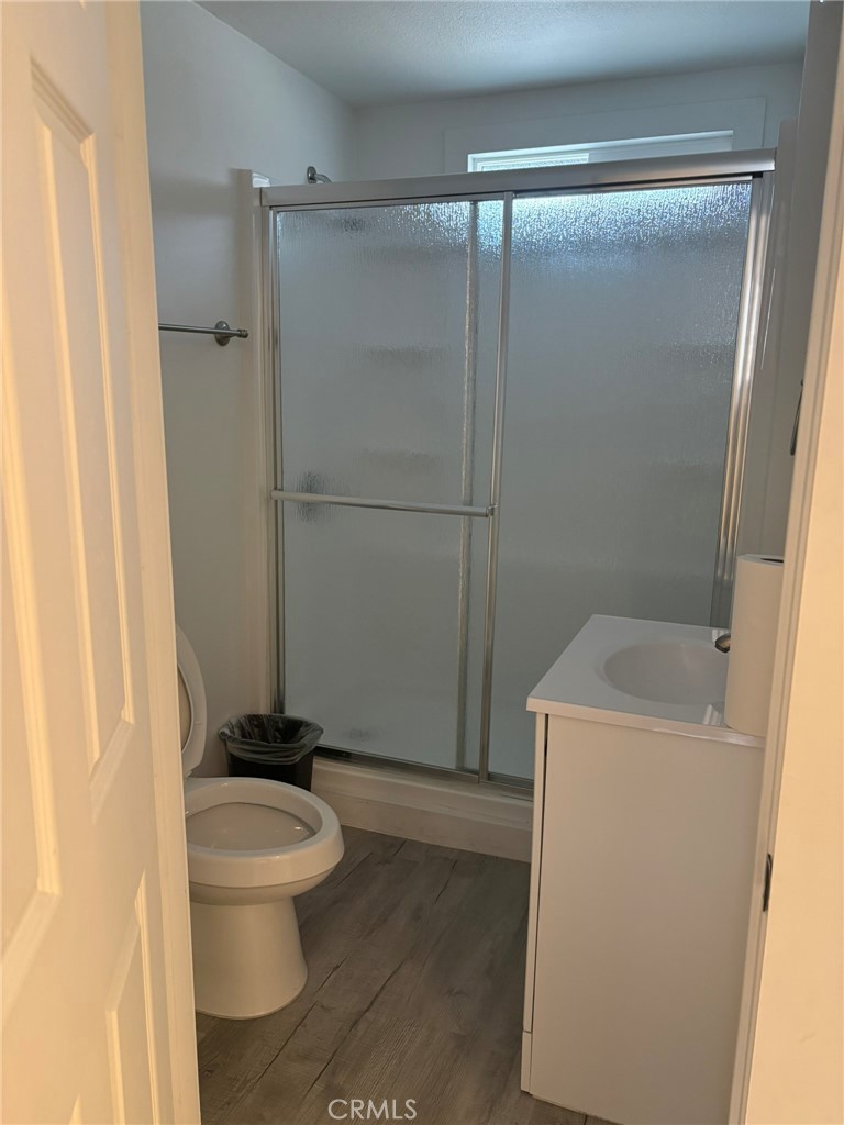 1362 South Downey Road Los Angeles, CA 90023 - Photo 30 of 30 a white toilet sitting next to a bathroom sink