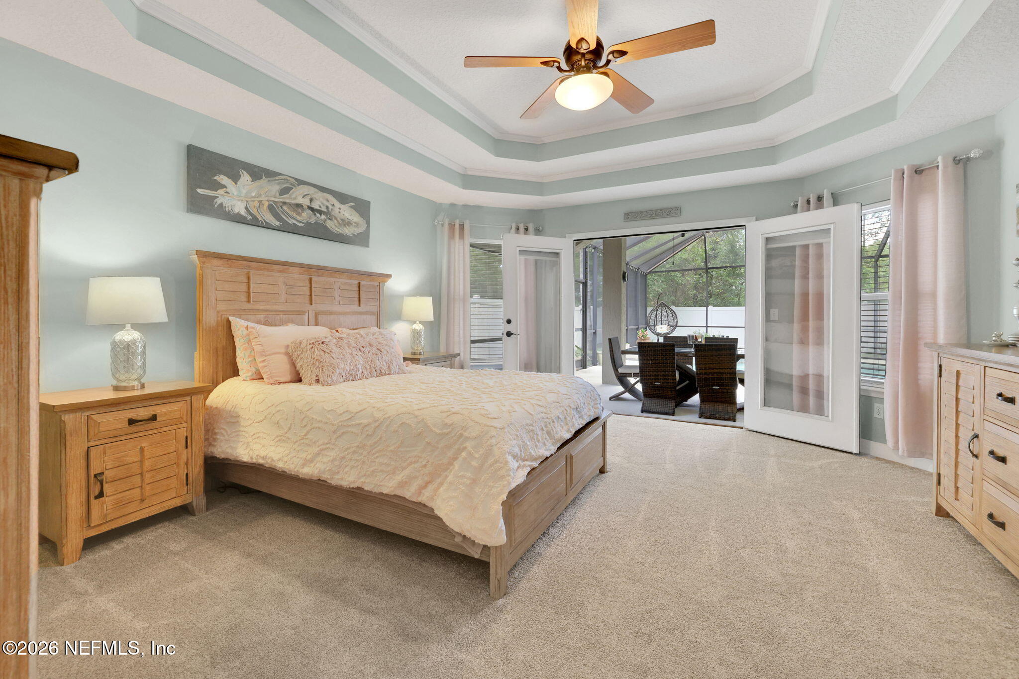 4320 Rye Court St. Johns, FL 32259 - Photo 30 of 60 a spacious bedroom with a bed couch painting on the wall and a window