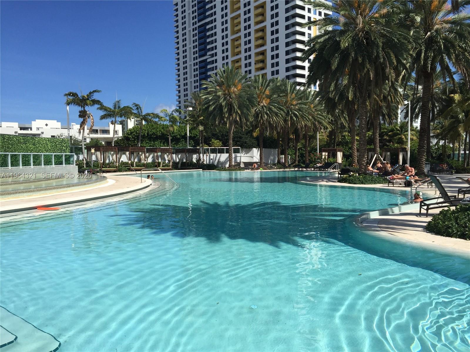1500 Bay Road, Unit 544S Miami Beach, FL 33139 - Photo 15 of 32 a view of a swimming pool with a yard