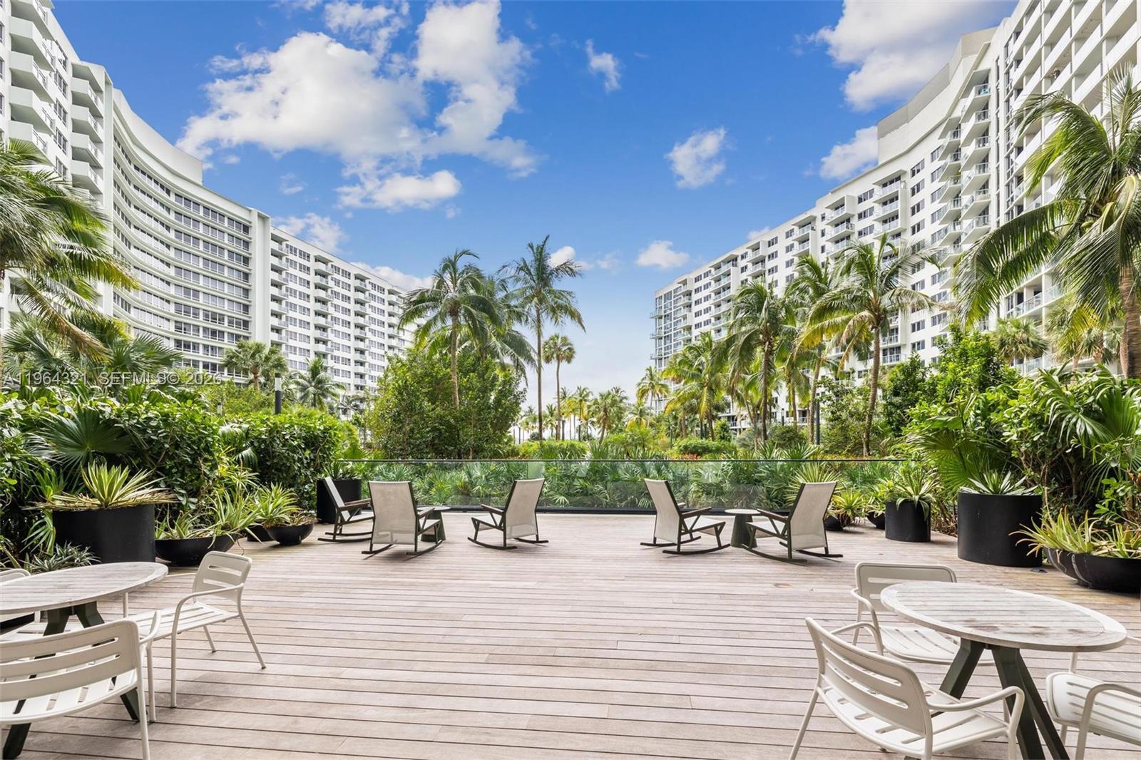 1500 Bay Road, Unit 544S Miami Beach, FL 33139 - Photo 22 of 32 a view of a swimming pool with a patio