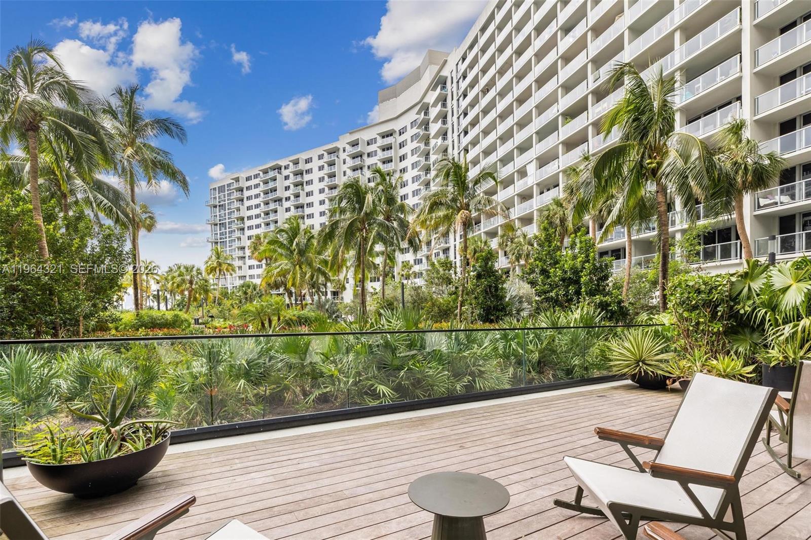 1500 Bay Road, Unit 544S Miami Beach, FL 33139 - Photo 23 of 32 a view of a balcony with lake view and wooden floor