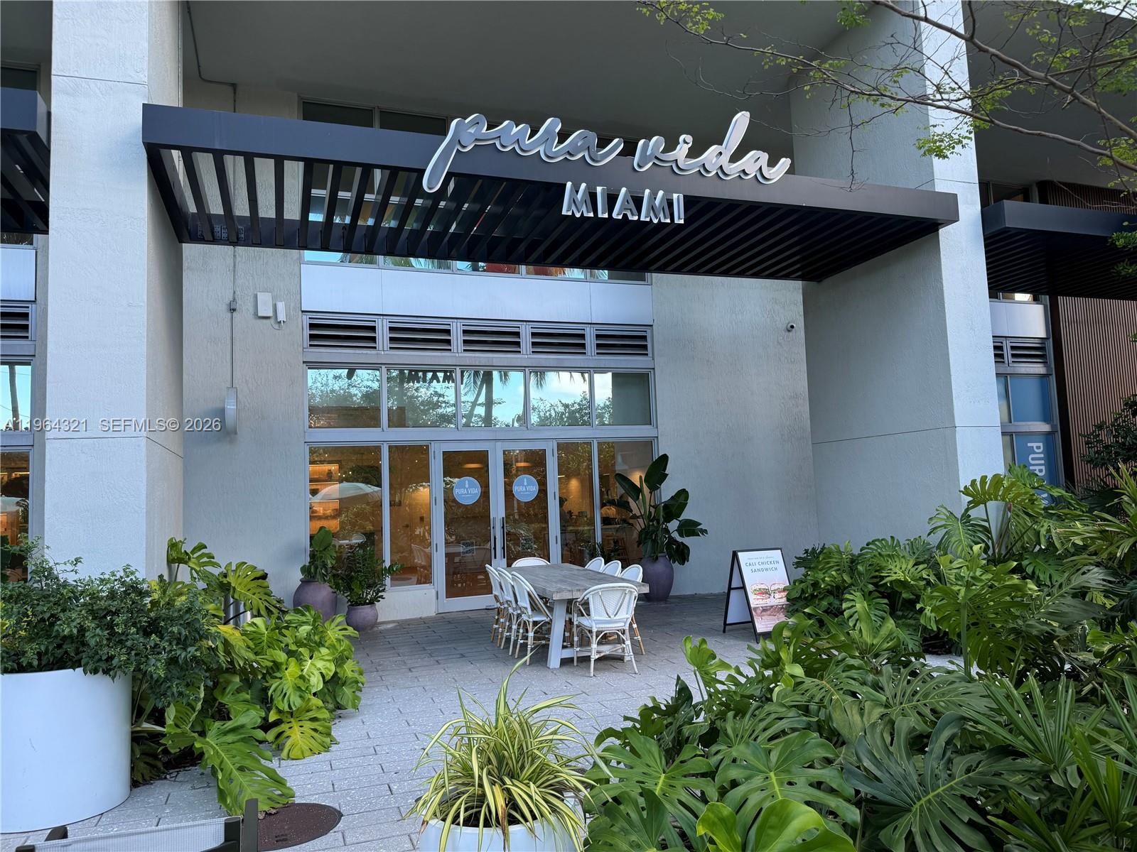 1500 Bay Road, Unit 544S Miami Beach, FL 33139 - Photo 31 of 32 a view of a porch with furniture and garden