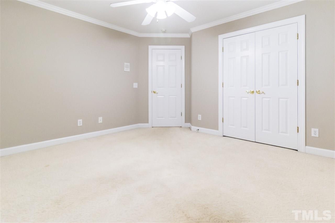 5204 Bakers Mill Road Durham, NC 27707 - Photo 22 of 25 an empty room with an entryway